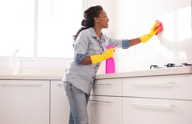 woman cleaning kitchen
