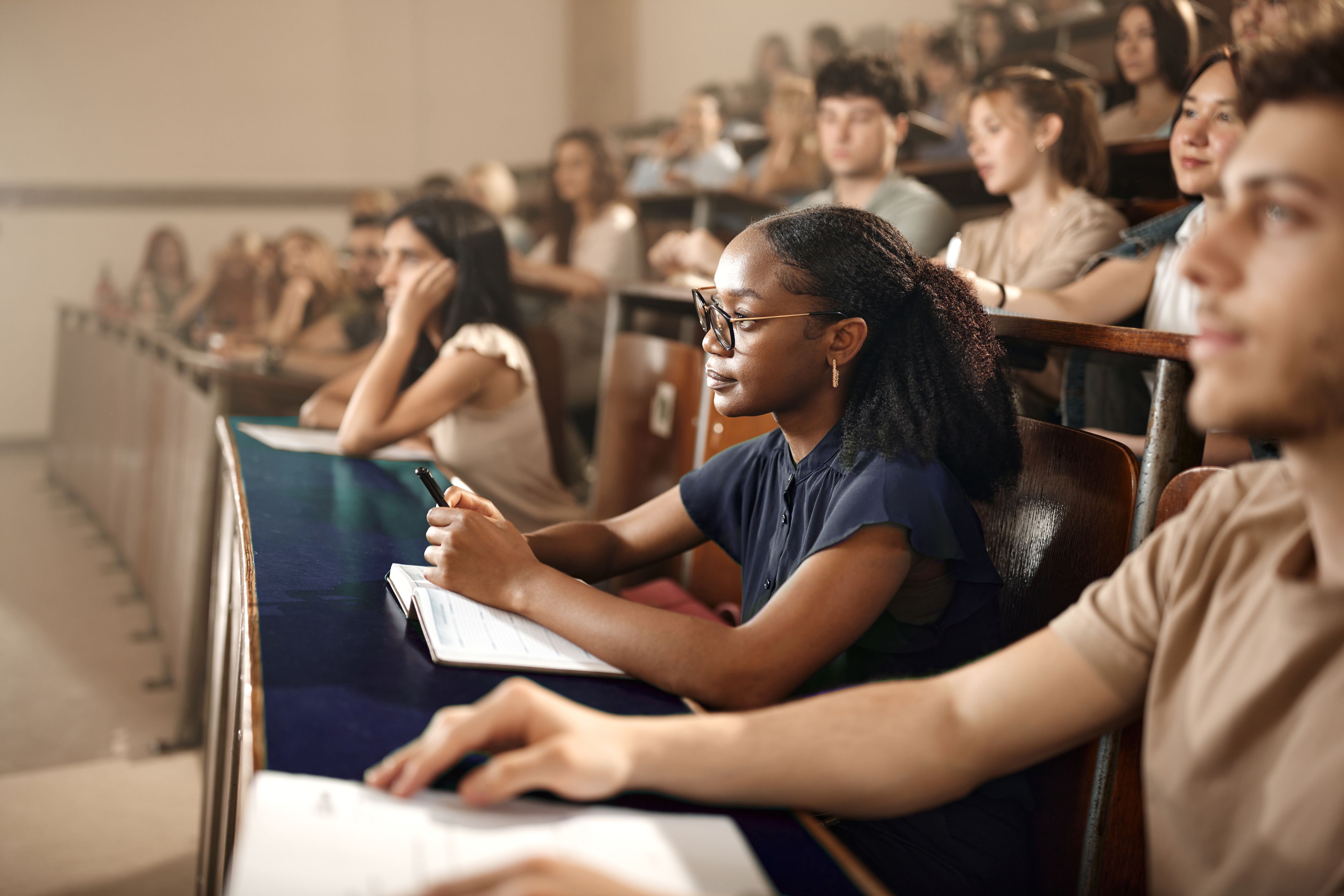 person holding black academic hat