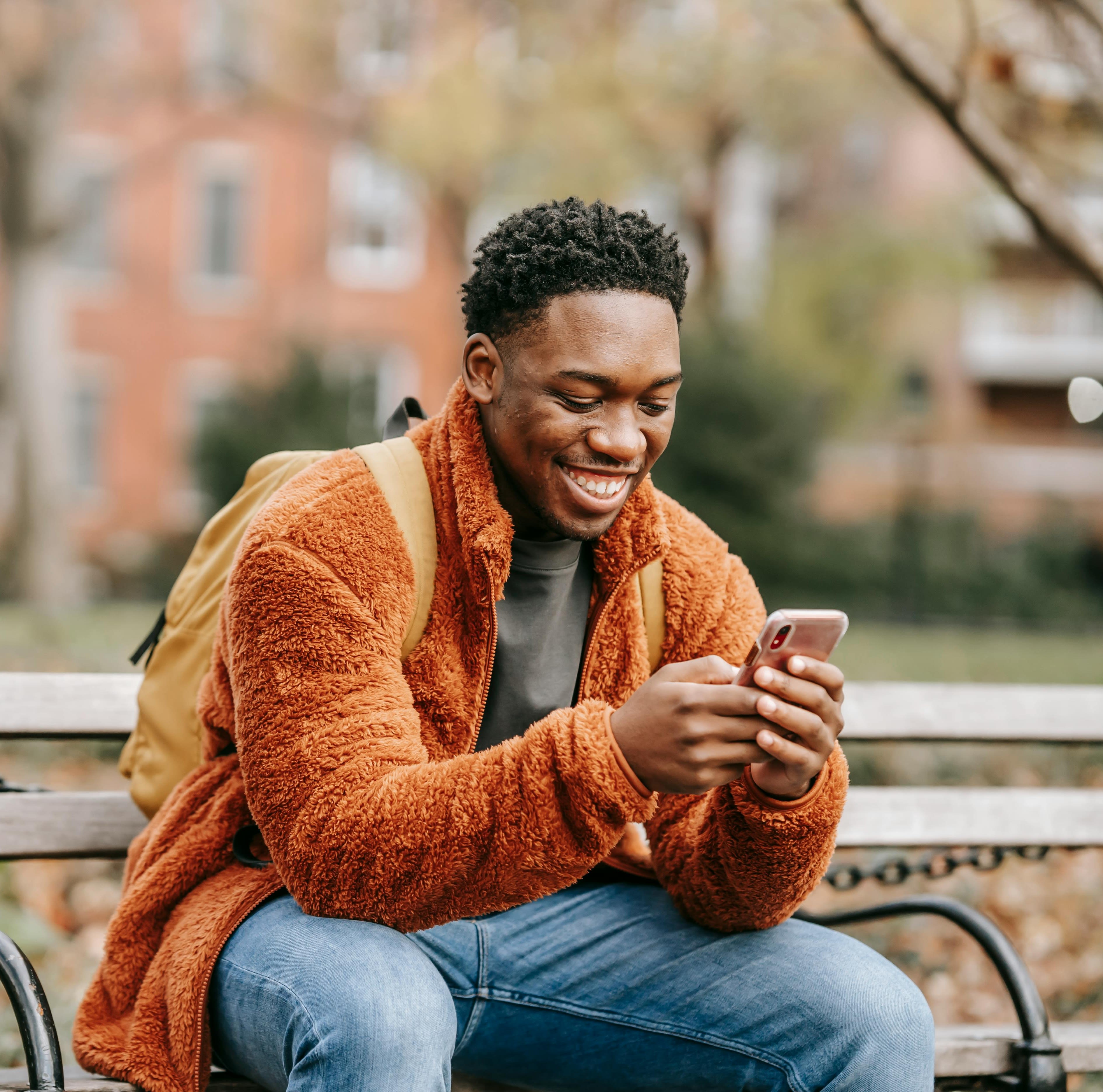 smiling woman wearing gray hoodie